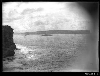 Steamship and tug leaving Sydney Harbour at North Head