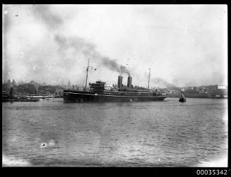 Tug towing twin funnel passenger ship