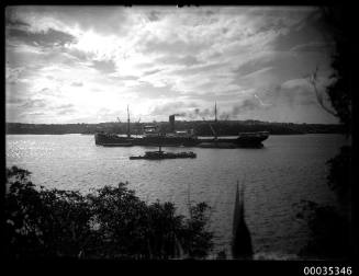 Portside view of cargo ship probably in Sydney Harbour