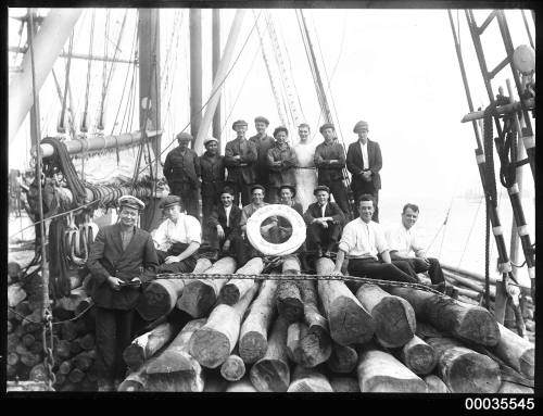 Image of crew men sitting on cargo aboard HELEN B. STERLING.