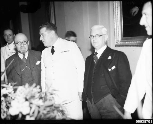 Captain P C Adelus of the Marine Nationale's FR AMIRAL CHARNER at a reception