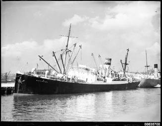 SS BUTESHIRE listing alongside a wharf