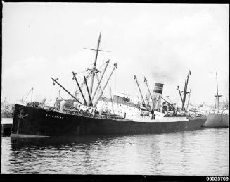 SS BUTESHIRE listing alongside a wharf