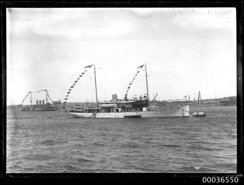 Steam yacht PIONEER moored in Sydney Harbour, dressed all over