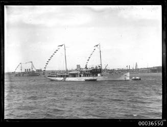 Steam yacht PIONEER moored in Sydney Harbour, dressed all over