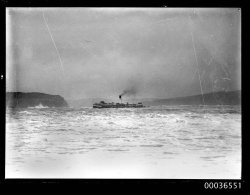 Ferry in harbour with Middle Head visible in background