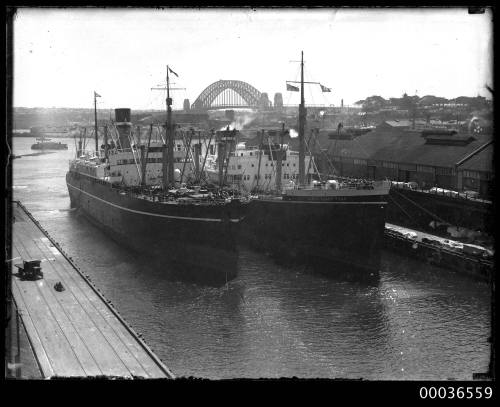 NEW ZEALAND STAR docked alongside another ship