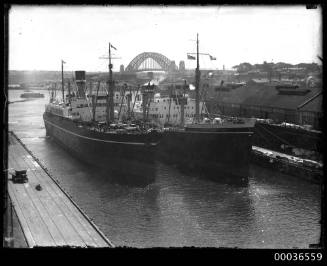 NEW ZEALAND STAR docked alongside another ship