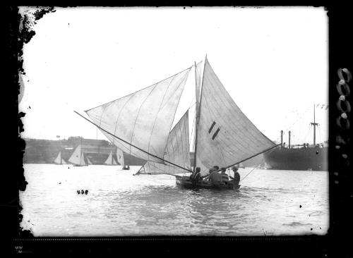 10-footer off Cockatoo Island with dressed ship in background