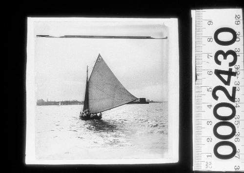 Large open boat sailing near Fort Denison, Sydney Harbour