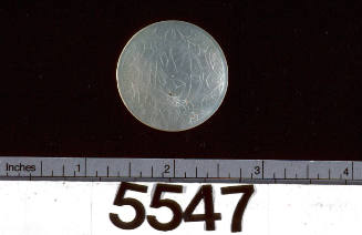 Polished pearl shell with incised design of birds