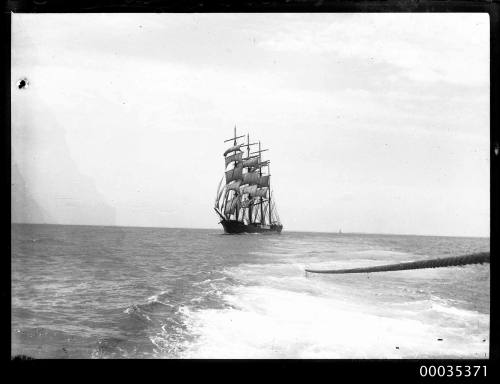 Four masted barque under tow