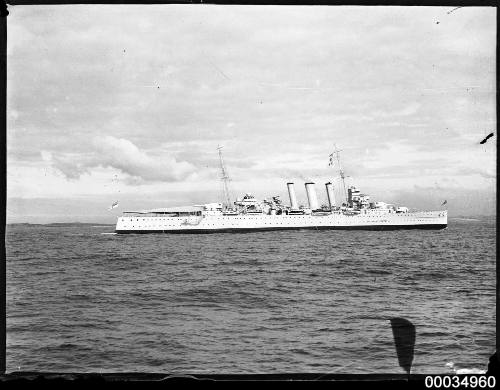 Starboard view of three funnel warship at sea