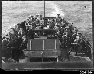 ABC Military Band playing with ABC commentator on a vessel