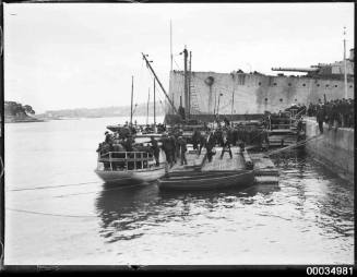 Men departing Garden Island after visiting the former HMAS AUSTRALIA (I)