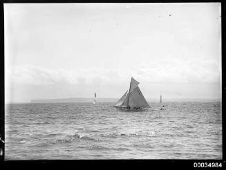 Gaff rigged cutter, 'RI' on mainsail, passing a marker buoy