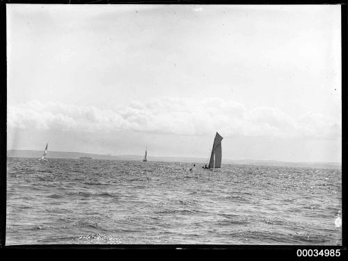 Gaff rigged cutter, approaching a marker buoy