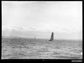 Gaff rigged cutter, approaching a marker buoy