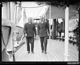Two ship's officers walking on the deck of SS ORUNGAL
