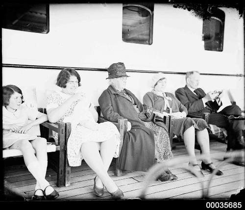 Passengers sitting on the deck of SS ORUNGAL