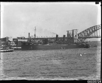 Unidentified passenger vessel with tug departing Sydney Cove.