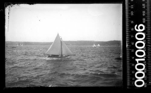 Starboard side view of a motor sailer on Sydney Harbour