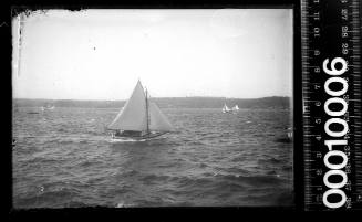 Starboard side view of a motor sailer on Sydney Harbour