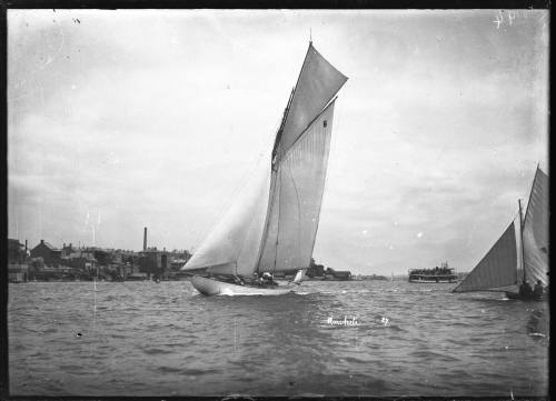 Portside view of the yacht RAWHITI displaying the number '6' on the mainsail, Sydney Harbour