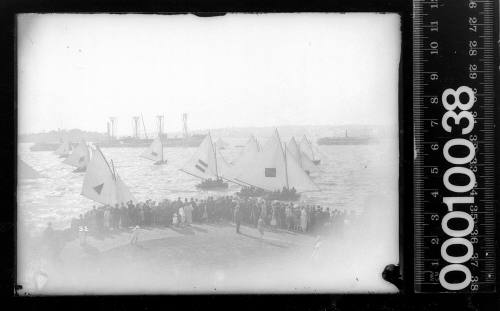 Spectators watching start of an 18-footer  race off Clark Island, Sydney Harbour