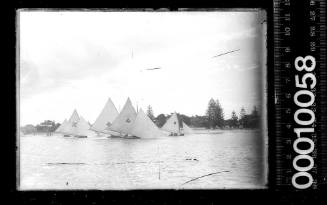 Damaged image of 18-footers and 14-footers sailing close to shore, Botany Bay.