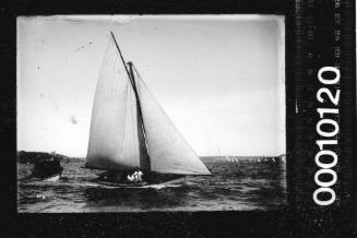 Half-decked centreborder and a small motorboat on Sydney Harbour