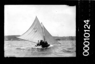 10-footer displaying the number '185' and the Australian flag on the mainsail, Sydney Harbour