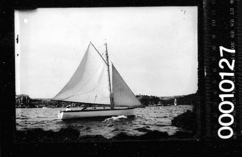 Starboard side view of a gaff rigged yacht, Sydney Harbour