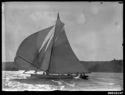 RAWHITI on Sydney Harbour, racing downwind under maximum sail area