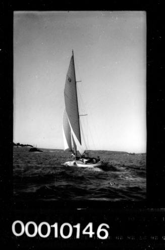 Bermudan rigged cutter with the number '33' displayed on the mainsail, Sydney Harbour