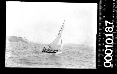 16-foot skiff with an industrial area visible in the background, Balmain, Sydney Harbour