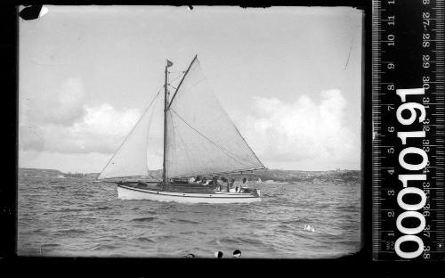 Portside view of a raised deck yacht with half cockpit, Sydney Harbour