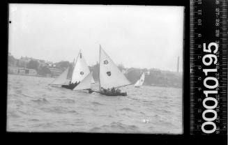 Three 16-foot skiffs racing off Whitehorse Point, Balmain, Sydney Harbour