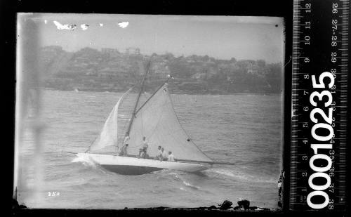 Gaffed rigged yacht reefed down in strong wind, Sydney Harbour