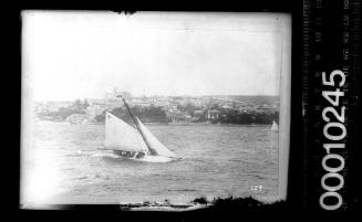 Gaff rigged yacht with the number '7' displayed on the mainsail, Sydney Harbour