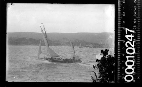 Two masted yacht with a Sydney Ferry visible in the background, Sydney Harbour