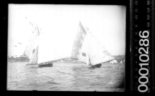 18-footers AUSTRALIA and ONDA at left on the leg between Shark Island and Clark Island, Sydney Harbour