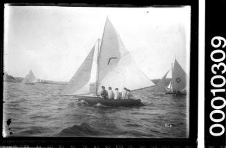 Open boat with a boomerang emblem on the mainsail, Sydney Harbour