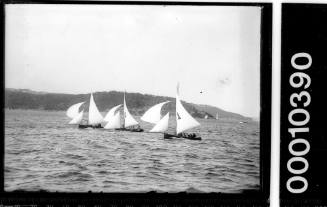 3 18-foot skiffs on Sydney Harbour, sailing on Harbour and Bradley's Head in distance