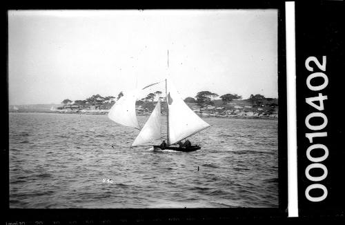 16-foot skiff sailing near shoreline, Sydney Harbour