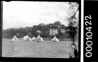 ARLINE leads a fleet of 18-footers off  Point Piper  inscribed 563