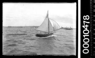 Cadet dinghy D8 under sail on Sydney Harbour