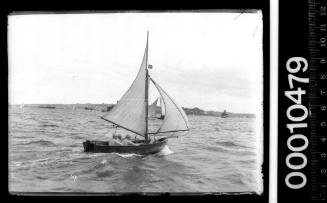 Cadet dinghy D8 under sail on Sydney Harbour