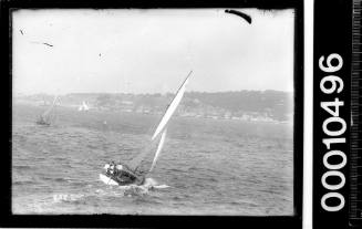 Stern view of an SASC yacht sailing on Sydney Harbour