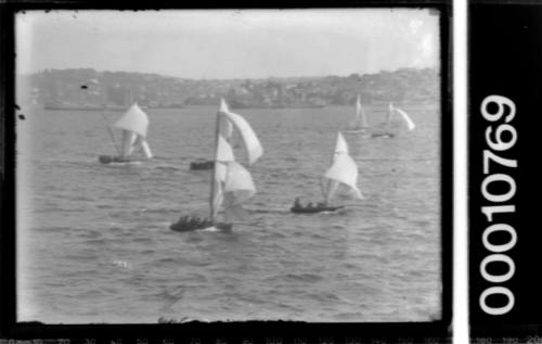 Unfocused image of a skiff race on Sydney Harbour